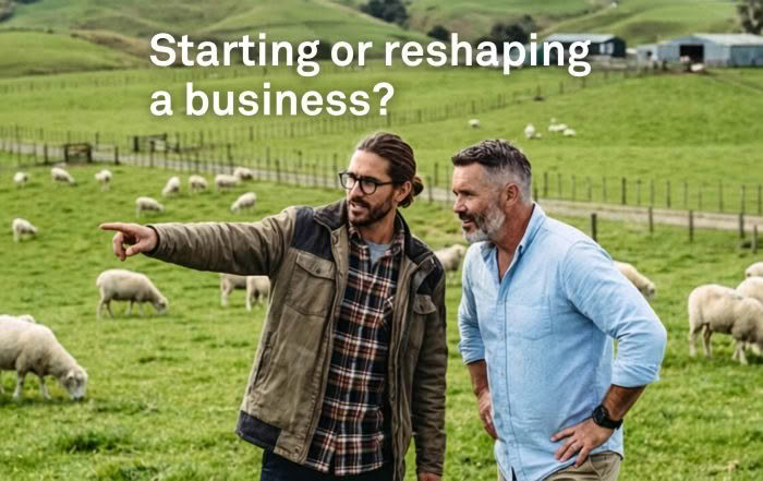 two male sheep farmers in a paddock
