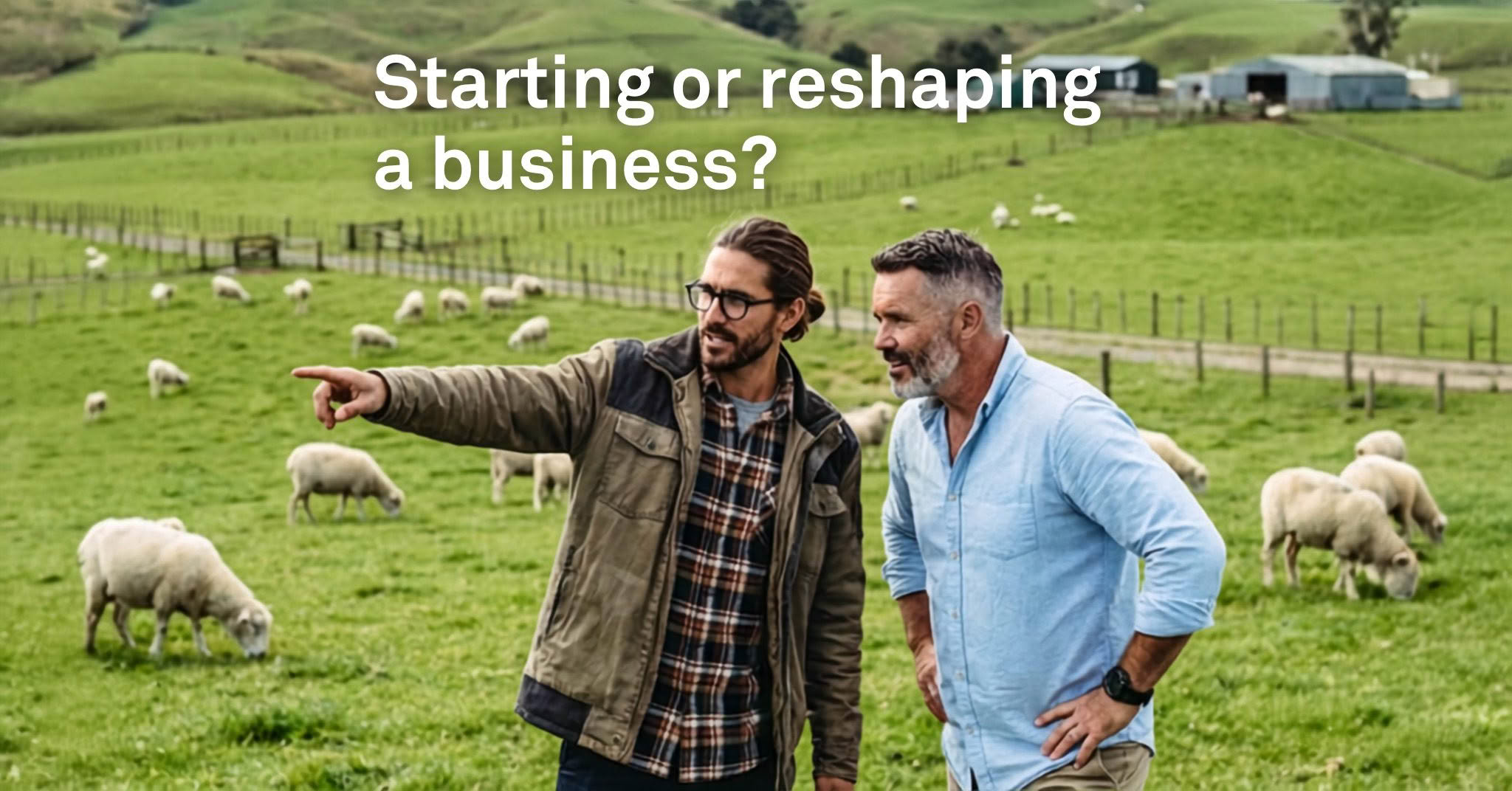 two male sheep farmers in a paddock